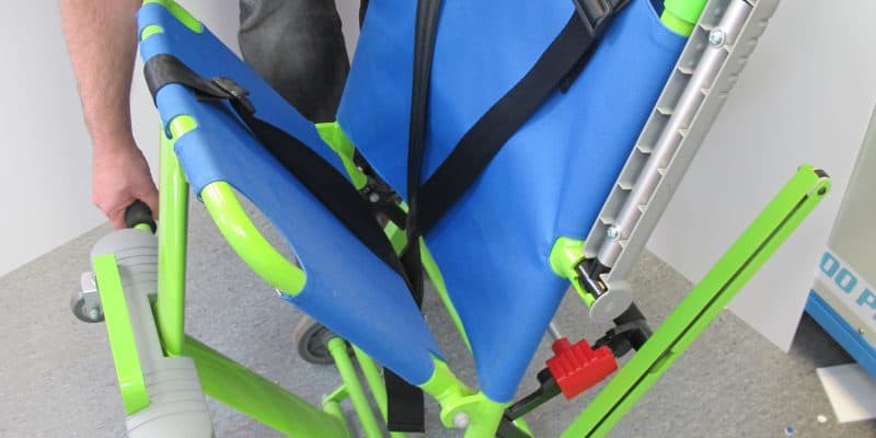 Evacuation chair being opened for servicing